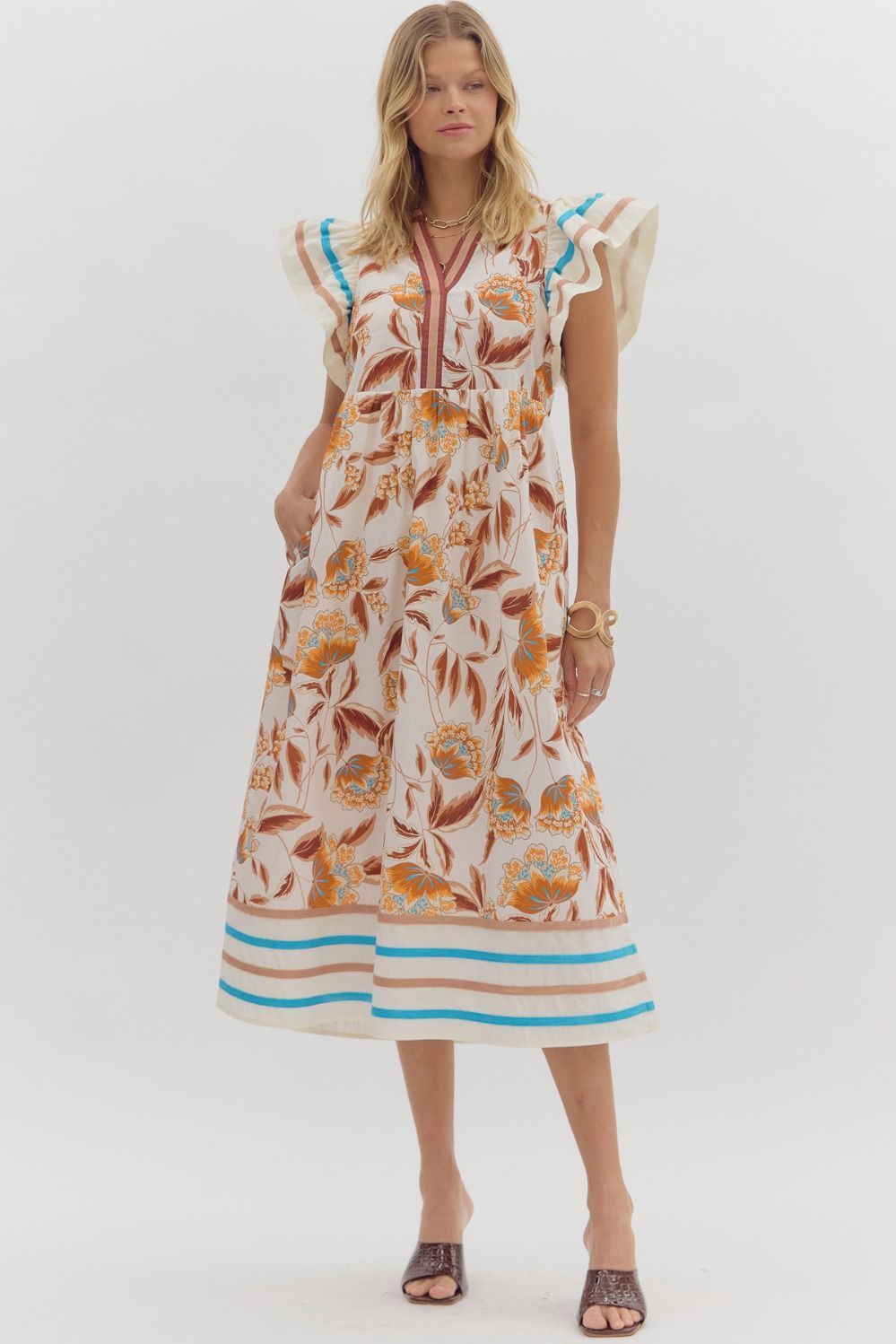 Woman wearing a floral dress with a white background