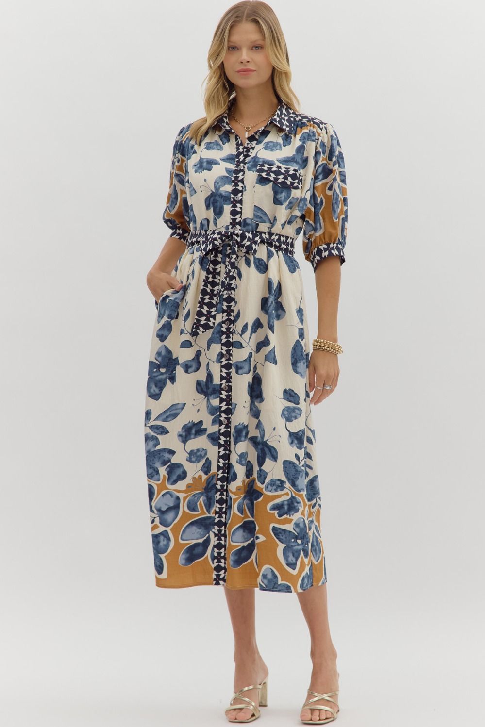 Woman wearing a floral dress with a white background