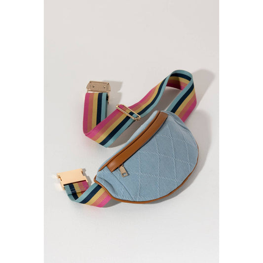 Keep everything you need right in reach with the Ali Belt Bag. Made from classic denim fabric with a rainbow colored belt strap, this bag can wrap around your waist or be slung fashionably across the body. 