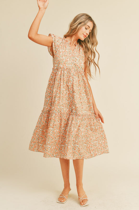 The midi-length &amp;Merci Allie Dress boasts short flutter sleeves, a ruffled neckline, and a button-down placket. It is designed with ruffle tiered layers and convenient pockets, and crafted from 100% cotton.