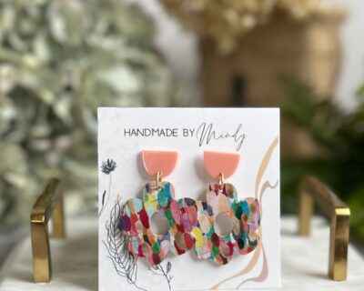 Annie Earrings - Mindy's Boutique
The Annie Earrings are simply amazing. These are the earrings you want to grab to tell the world you are ready to party. The peach half moon post and the splash of color genuine leather flower make the perfect pair of earrings.