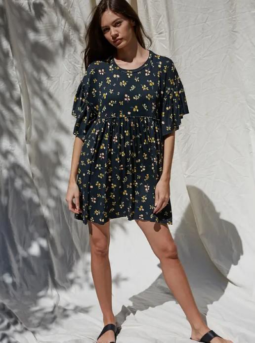 Bella Dress - Mindy's Boutique - Crafted from a premium knit viscose jersey material, this dress features a stylish print, short sleeves, and flattering ruffle detailing.