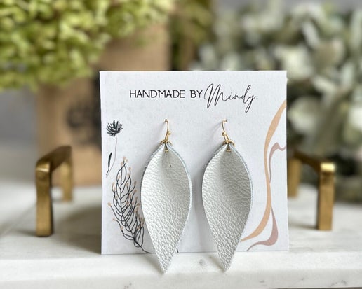 Clare Earrings - Mindy's Boutique - The Clare Earrings are versatile, lightweight, and stylish. Crafted from genuine white leather, these reverse teardrop earrings are a perfect addition to any outfit.