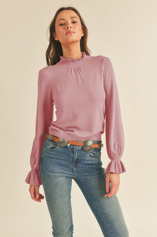 Dana Sweater - Mindy's Boutique - The Dana Sweater features a knit pullover design with ruffled detailing, long sleeves with ruffled cuffs, and ribbed edges.