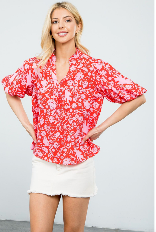 Introducing our latest addition, the THML East Beach Top, featuring a chic puff sleeve design and a beautiful flower print. Perfect for any occasion, this top is sure to elevate your style.

Fabric Content: 100% Polyester

Brand: THML