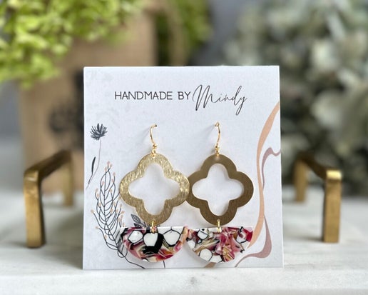 Crafted from colorful half moon acetate and adorned with a captivating quatrefoil-shaped gold accent, the Jessica Earrings effortlessly complement any ensemble with their unique yet minimalistic design. Perfect for any occasion, these handmade earrings are a must-have accessory.

Hypoallergenic, lightweight, nickel, lead, and cadmium free.