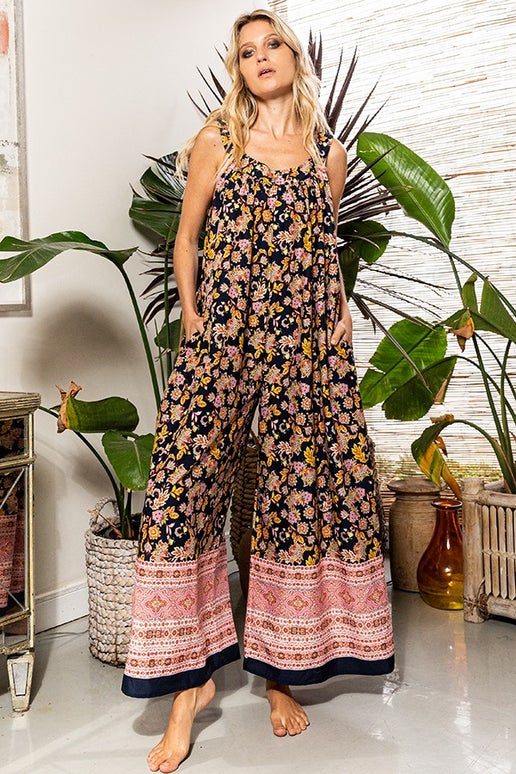 This Jumpsuit features a scoop neckline and wide leg design, as well as hidden pockets on the side. It is made of lightweight, knit fabric and boasts an oversized border print for added style.

Brand: Bucketlist