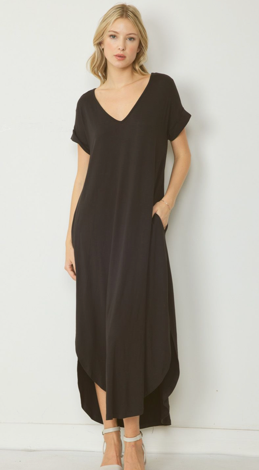 This v-neck maxi dress is made of jersey knit and features a pocket detail on the side. It has a permanent rolled sleeve and a rounded hem. The dress is unlined and lightweight. Additionally, it is a knit material and not sheer.

Fabric Content 94%POLYESTER 6%SPANDEX

Model is 5'10" and wearing size Small