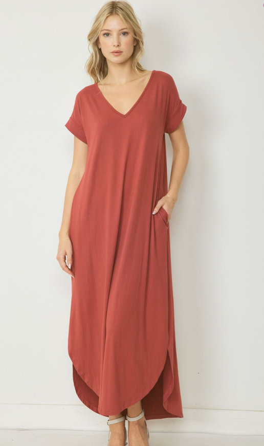 This v-neck maxi dress is made of jersey knit and features a pocket detail on the side. It has a permanent rolled sleeve and a rounded hem. The dress is unlined and lightweight. Additionally, it is a knit material and not sheer.

Fabric Content 94%POLYESTER 6%SPANDEX

Model is 5'10" and wearing size Small