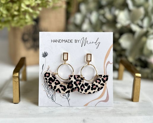 Combining real gold plated posts with leopard print leather rainbow arches, these one-of-a-kind earrings are guaranteed to attract attention. They are designed for effortless wear and are both lightweight and absolutely charming, making them a must-have accessory.

Length 1.8”

Hypoallergenic, lightweight, nickel, lead, and cadmium free.