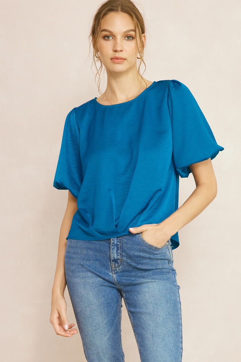 Solid textured satin short sleeve top featuring gathered detail at hem. Unlined. Woven. Non-sheer. Lightweight.

Fabric: 100%POLYESTER
Model&nbsp;5'10" and wearing size Small.
Color: Teal&nbsp;