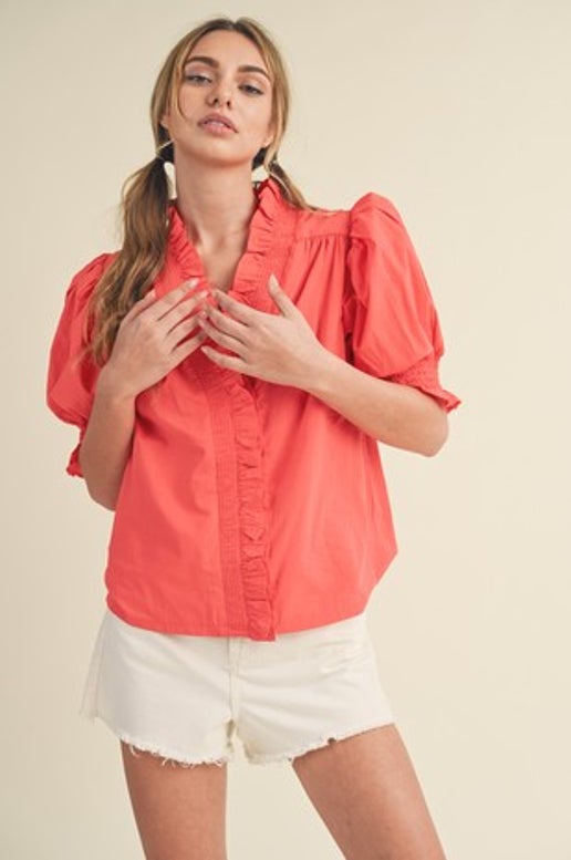 Expertly designed with a surplice neckline, smocking, and ruffle trim, the Laura Top features short puff sleeves with smocked ruffle cuffs for a relaxed fit. Utilizing precise measurements and quality materials, this top is both stylish and comfortable, making it a staple piece in any wardrobe.

Details:

Model is 5'7" and wears a S

Fabric Contents: 100% COTTON

Brand: &amp;Merci