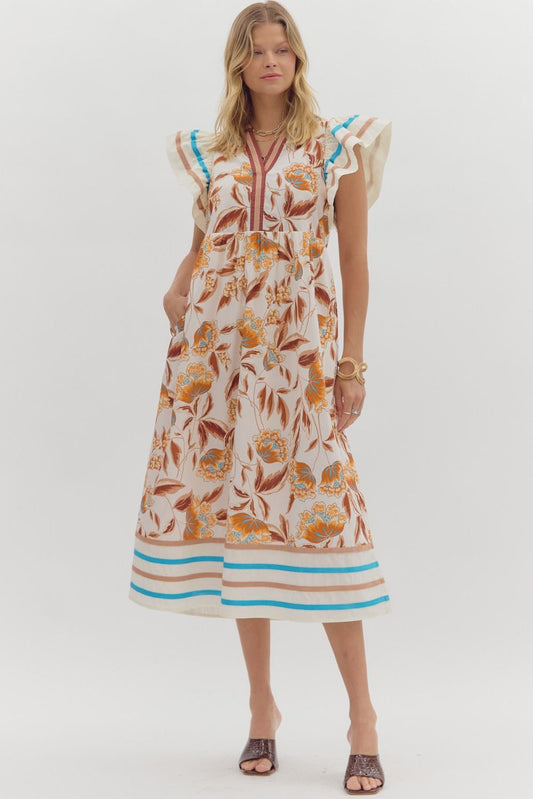 Woman wearing a floral dress with a white background