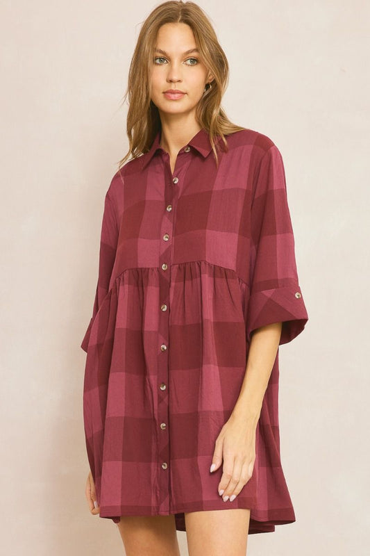 Checkered collared button down half sleeve mini dress featuring permanent rolled cuffs. Lined. Woven. Non-sheer. Lightweight.

Fabric:&nbsp;50%POLYESTER 43%RAYON 7%LINEN
Model&nbsp;5'10" and wearing size Small.
Color: Burgandy&nbsp;