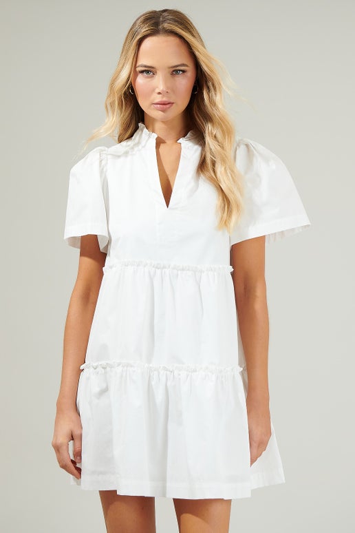 Easy to dress up or down. The Martha dress is perfect for those on-the-go moments when you haven't a clue what to wear. Made from a lightweight and breathable cotton, it features a banded collar, split neckline. Short sleeves, somewhere in between a tulip and flutter silhouette, frame a tiered babydoll dress. Side pockets are added for convenience. Keep it casual with high top sneakers or go dress and pair the look with tie strap heels.

Lightweight - Split neck - Pockets - Tiers.

Model is 5'8" and wearing