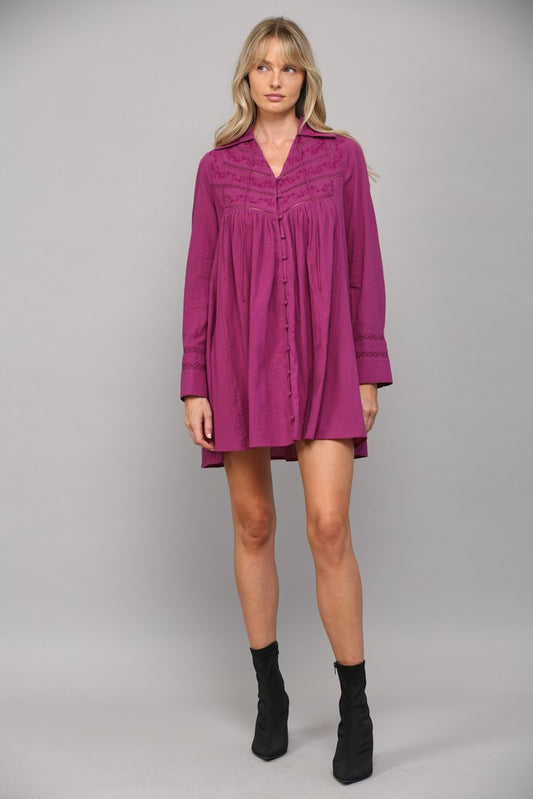 Expertly crafted from premium cotton, this tunic dress features

a button front and split neck design for a sophisticated look.

Fabric Contents: 100% COTTON

Color: Magenta