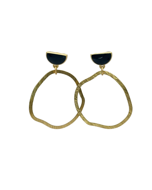 Elevate any outfit with the Sinead Earrings. Crafted with stunning organic gold circles and delicate black half moon studs, these earrings are a must-have accessory.

Hypoallergenic, lightweight, nickel, lead, and cadmium free.

Length 1.75’