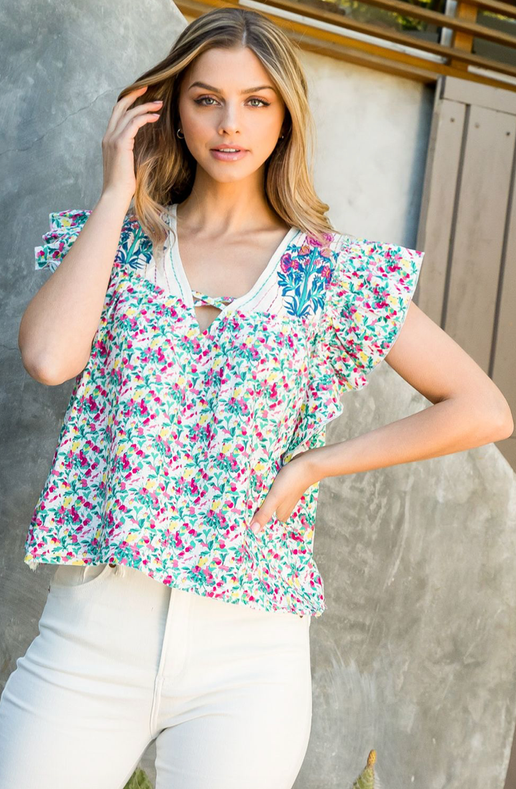 Expertly embroidered with a beautiful floral print, this top is the perfect addition to your wardrobe.