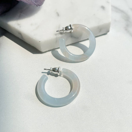 These small Italian acetate hoops are perfect for any occasion - wear them with a work outfit or pair them with jeans and a t-shirt for a casual night with friends. They are effortlessly stylish and versatile, ticking all the boxes.

Size 24mm 925 sterling silver posts Italian acetate