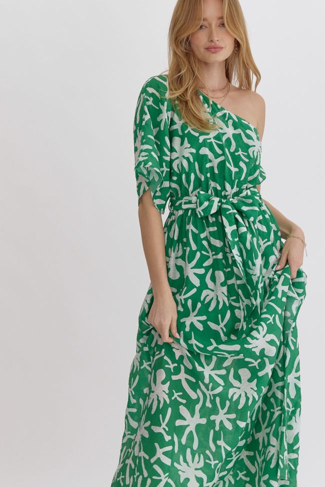 Model wearing green one-shoulder printed midi dress with tie waist and side slit by Entro
